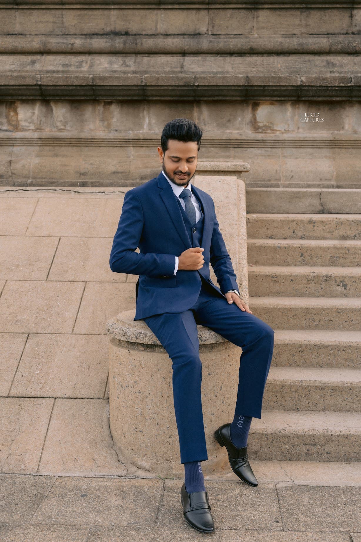 Yathindra Kodithuwakku in a navy suit